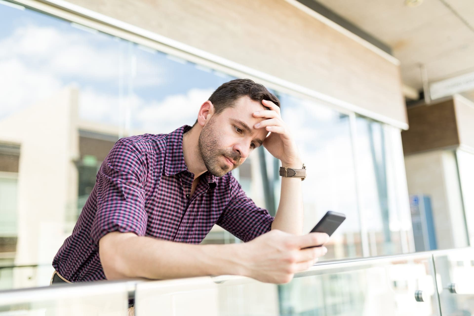 An impatient visitor waiting on their phone for a slow website to load